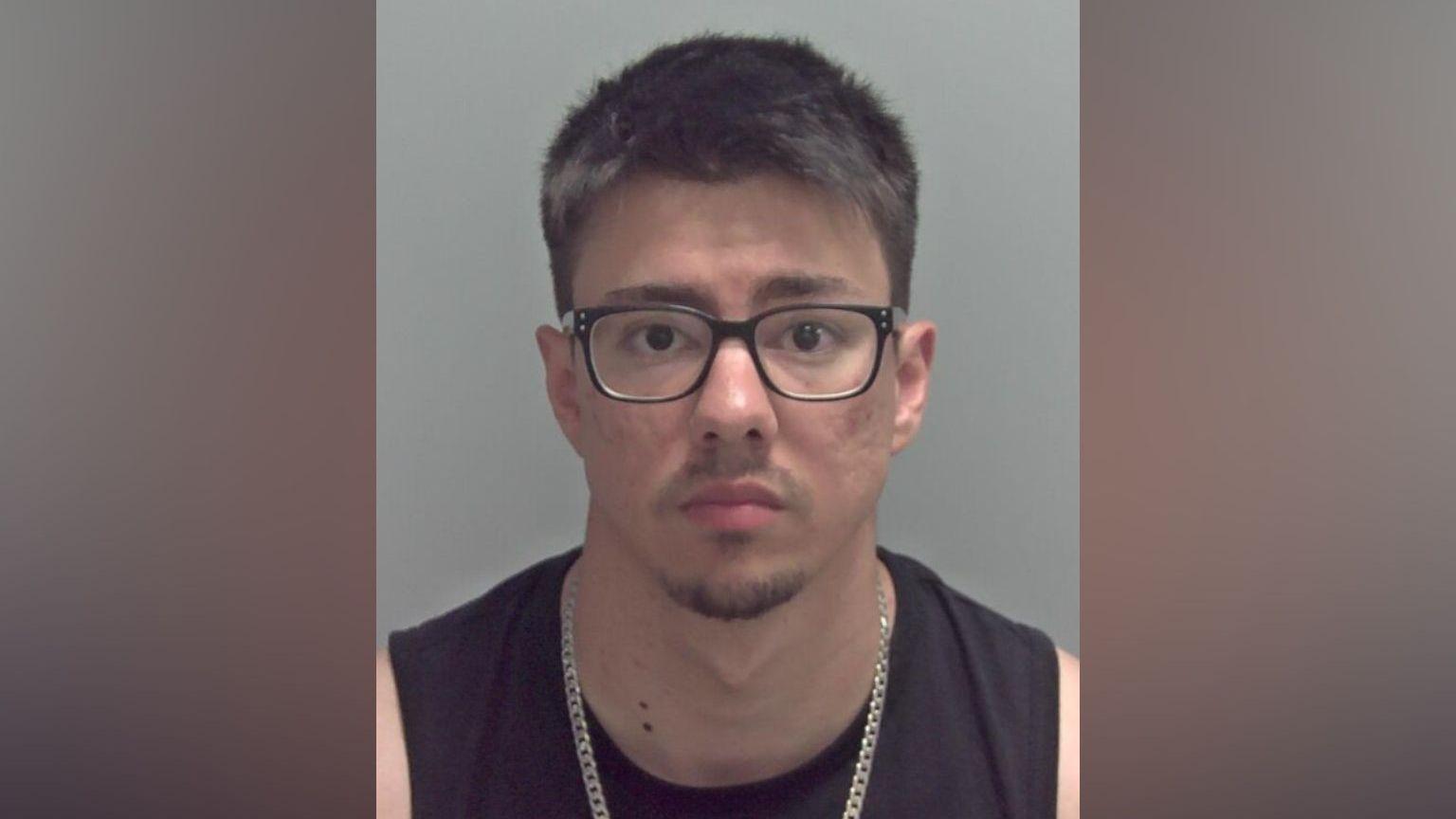 Police photograph of Zack Garrido